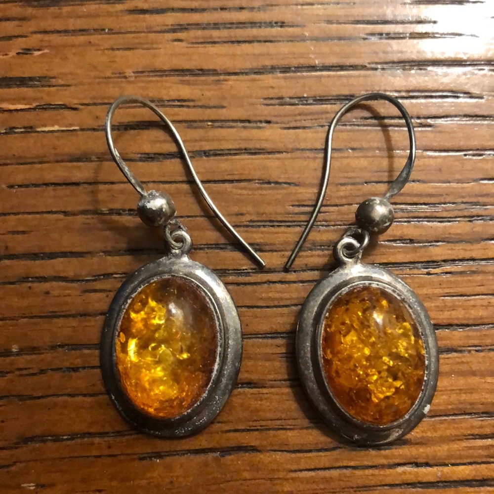 Amber earrings on silver wires cabochan oval shape unmarked cleans like silver
